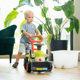 Traktor med rat, horn og skubbehåndtag Claas Vintage FALK – babylegetraktor til 1–3 år, gangstøtte og motorikleg Claas Vintage babylegetraktor fra FALK med rat, horn og rødt skubbehåndtag; grøn retro-ride-on for børn 1–3 år, fungerer som stabil gangstøtte og stimulerer motorik