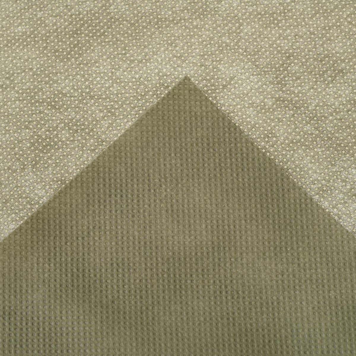 Nærbillede af beige mønstret tekstil med struktur