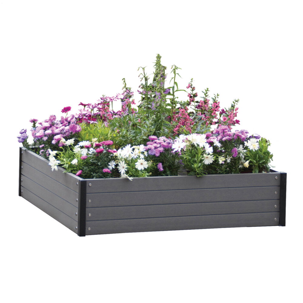 Gråt komposit højbed fyldt med farverige blomster