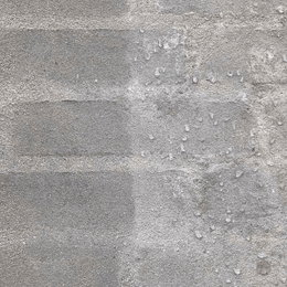 Nærbillede af grå ru betonvæg