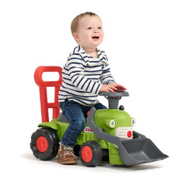 Traktor med rat, horn og skubbehåndtag Claas Vintage – FALK babylegetraktor til 1-3 år Barn sidder på grøn Claas Vintage babylegetraktor med rat, horn, frontskovl og rødt skubbehåndtag – FALK legetøj, ideel som gangstøtte og til motorisk leg for 1-3-årige