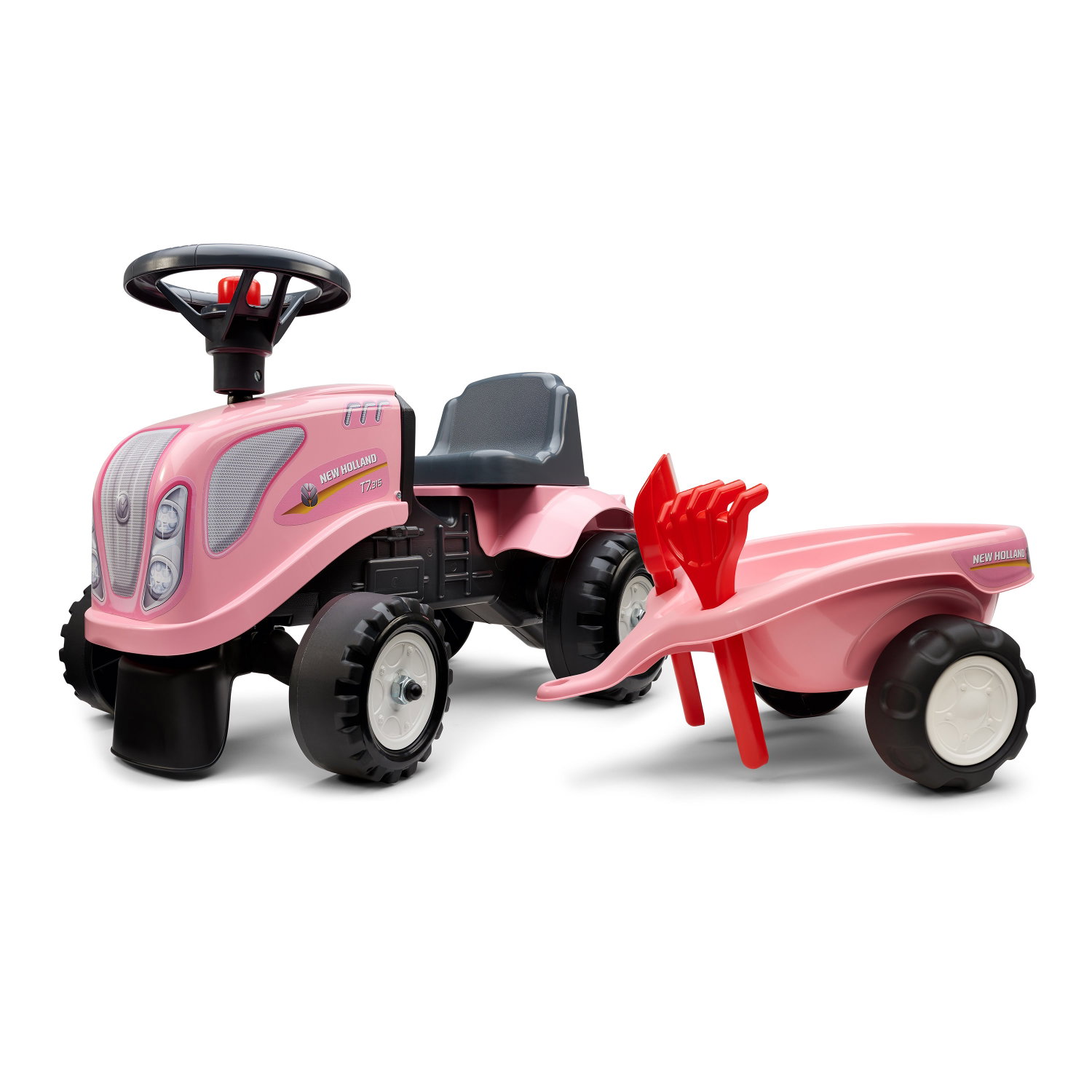Lyserød New Holland pedaltraktor med trailer og skovl
