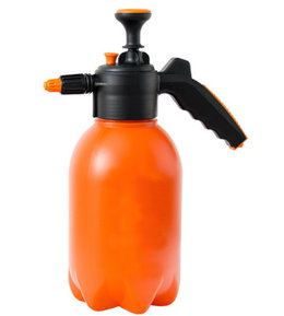 Orange håndholdt tryksprøjte til planter